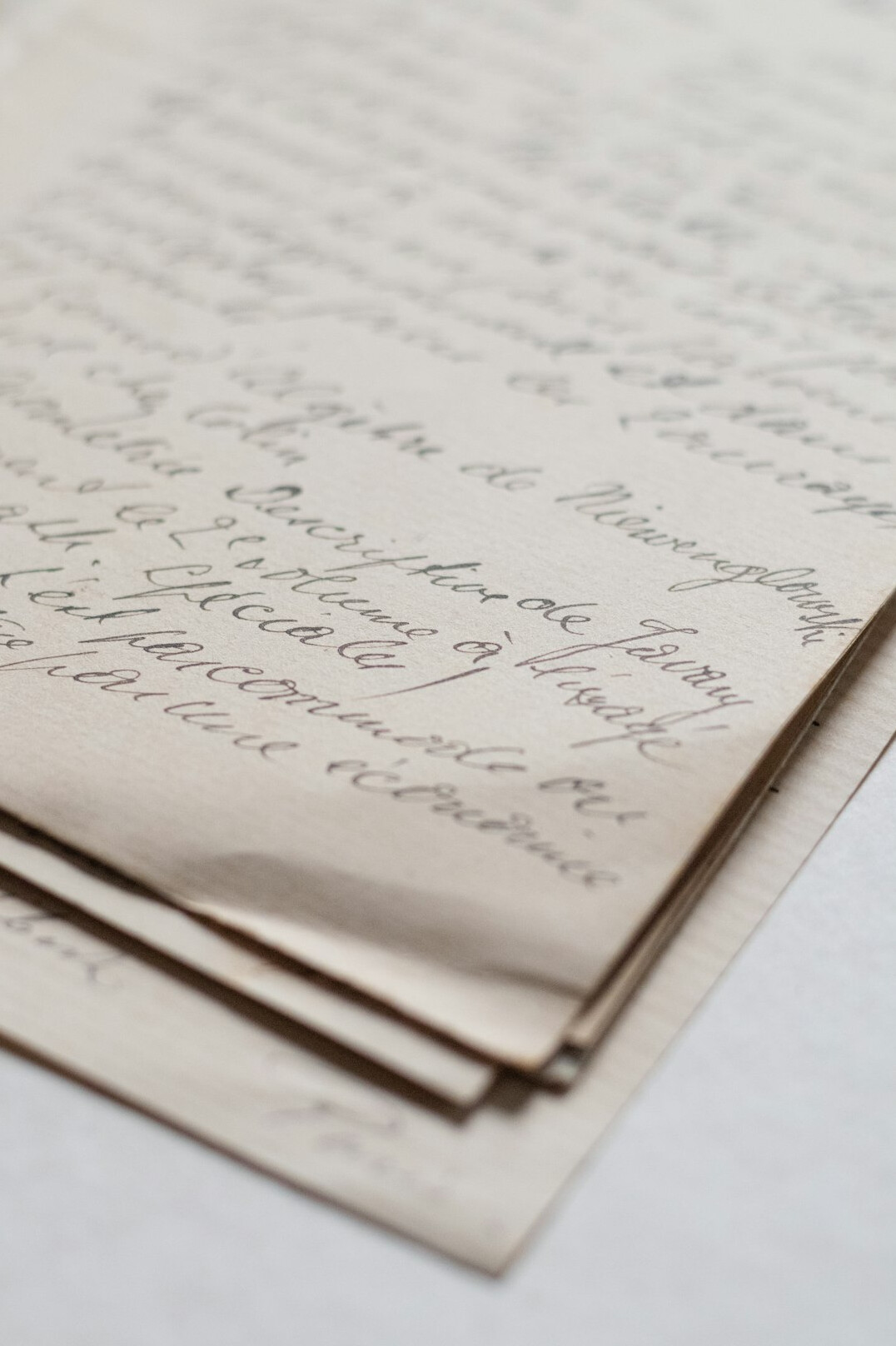 Old handwritten letters and ink pen on paper